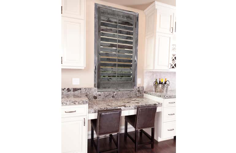 Kitchen window with reclaimed wood shutters in Dover